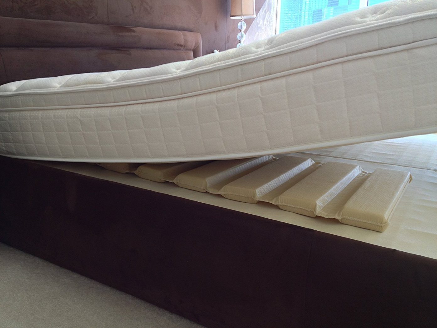 under mattress insert to raise bedding off feet
